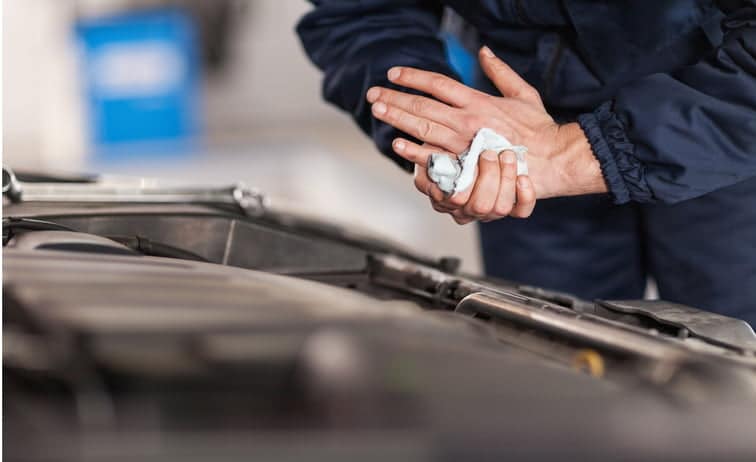 Mechanic wiping his hands clean