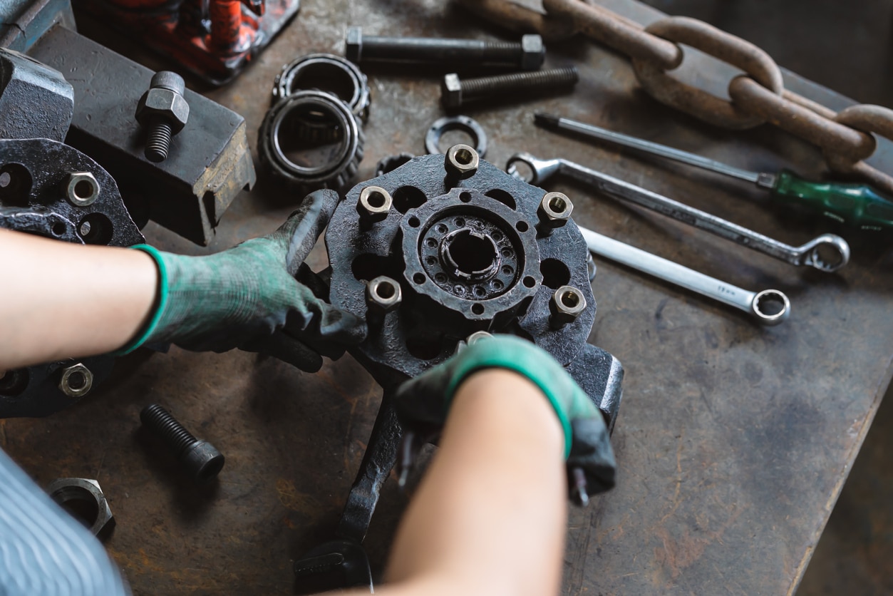 mechanic holding parts