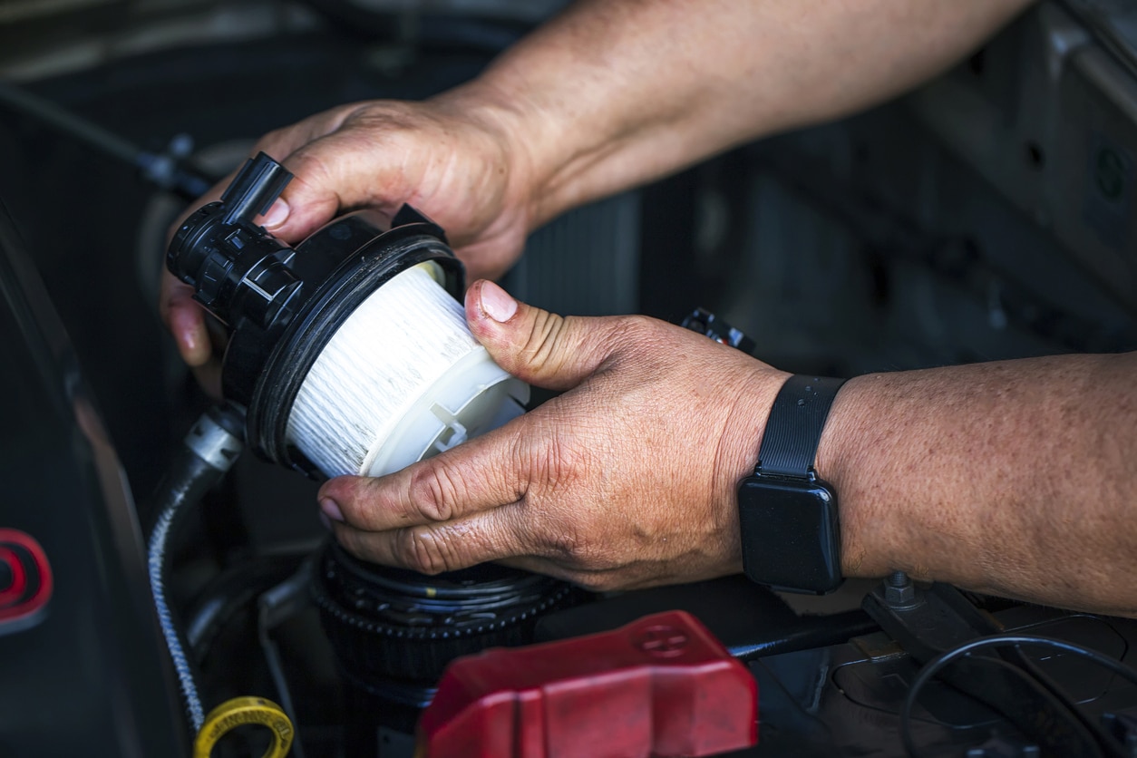 Someone holding a Fuel Filter