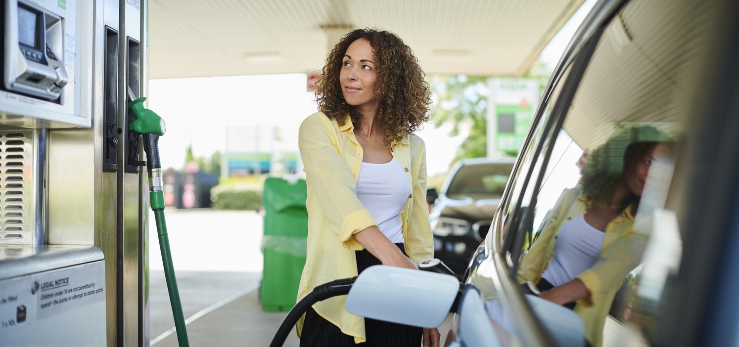 woman filling up at the petrol pump